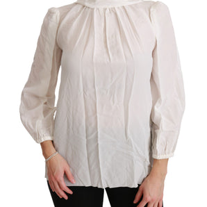 Dolce &amp; Gabbana Elegante blusa de seda blanca con cuello alto