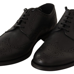 Dolce &amp; Gabbana Elegantes zapatos Derby de cuero negro con punta de ala