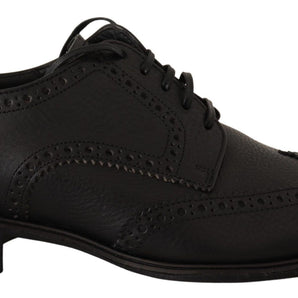 Dolce &amp; Gabbana Elegantes zapatos Derby de cuero negro con punta de ala