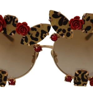 Dolce &amp; Gabbana Elegantes gafas de sol redondas de metal con detalle de rosa