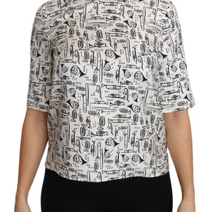 Dolce &amp; Gabbana Top elegante blusa de seda con estampado de trompeta