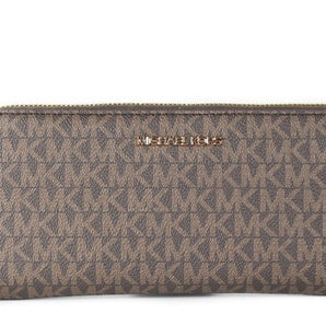 Michael Kors Jet Set Travel Cartera grande tipo pulsera continental con firma en color marrón