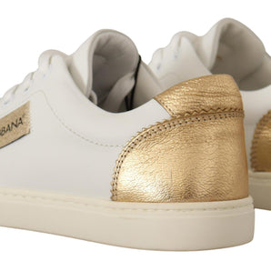 Dolce &amp; Gabbana Elegantes zapatillas deportivas de cuero blanco con detalles dorados