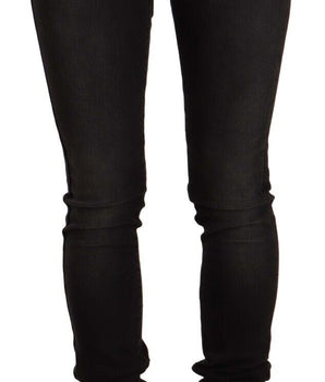 Vaqueros negros desgastados de corte slim Chic de GF Ferre