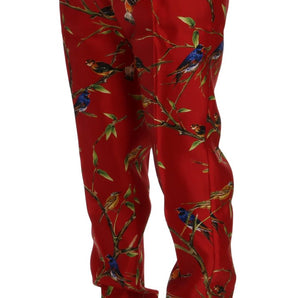 Dolce &amp; Gabbana Elegante pantalón de vestir de seda con estampado de pájaros rojos