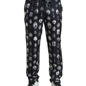 Dolce &amp; Gabbana Elegante pantalón jogger de seda con estampado religioso