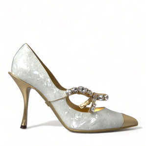 Dolce &amp; Gabbana Elegantes tacones con lazo de cristal de charol blanco