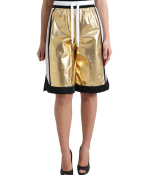 Dolce &amp; Gabbana Elegancia elevada: pantalones cortos dorados de cintura alta
