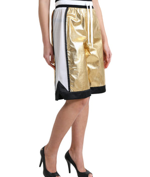 Dolce &amp; Gabbana Elegancia elevada: pantalones cortos dorados de cintura alta