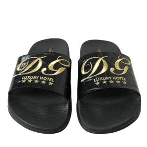 Dolce &amp; Gabbana Elegantes chanclas de cuero negro y dorado