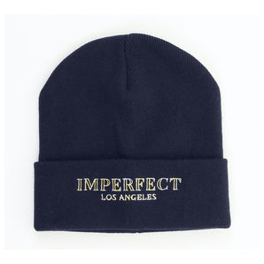 Gorra Imperfect Chic de acrílico azul con detalle de logotipo