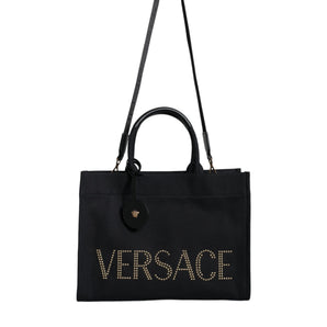 Versace Bolso tote cruzado con logo de cuero y lona con asa superior negra