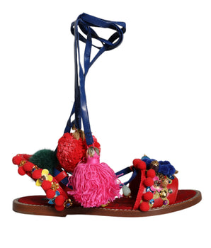 Dolce &amp; Gabbana Sandalias cruzadas de piel con pompones multicolores Zapatos