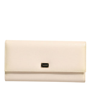 Cartera con tarjetero de piel beige de Dolce &amp; Gabbana con tres pliegues y placa del logotipo