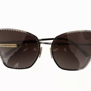 Gafas de sol Dolce &amp; Gabbana DG2212 con marco de metal ovalado, logo y encaje, color negro y plateado