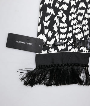 Bufanda tipo chal con flecos estampados en blanco y negro de Dolce &amp; Gabbana