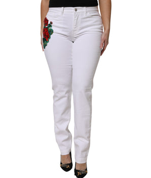 Vaqueros femeninos con lentejuelas y flores blancas de Dolce &amp; Gabbana