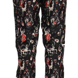 Dolce &amp; Gabbana Elegante pantalón lounge de seda negro con estampado rojo