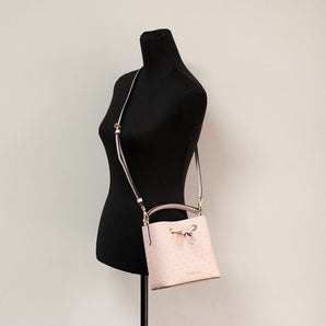 Michael Kors Suri Small Dark Powder Blush Signature PVC Bucket Crossbody Handbag, Nahim - Luxury Wardrobe